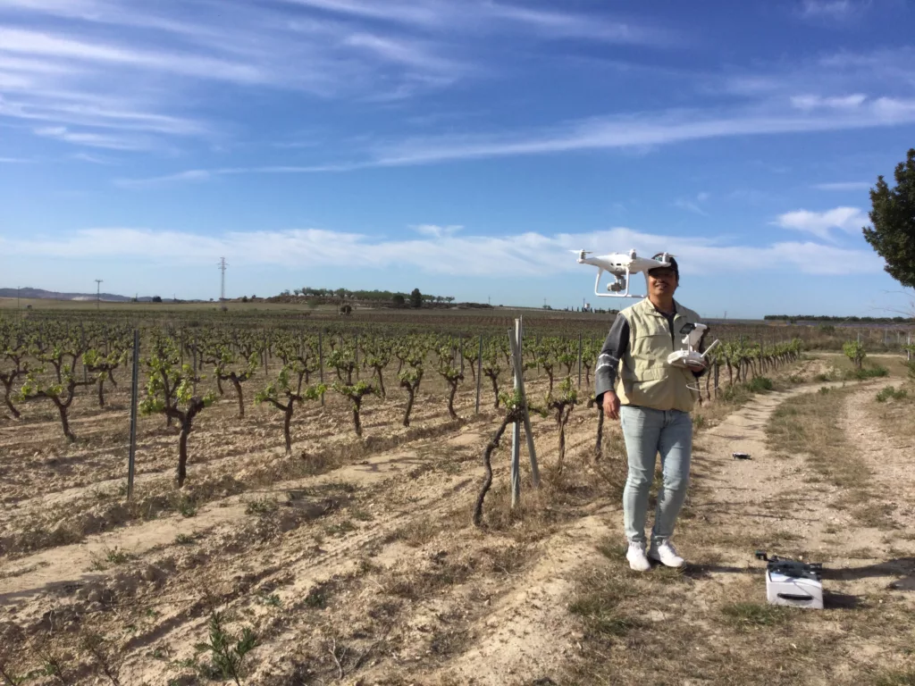 Agriculture regenerative experiment. Dr. Vladimir Baulin flying a drone in Catalonian vineyard. Photo taken on the 12th of April 2023